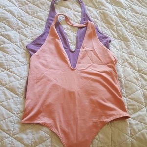 LOT of two express bodysuits. Size M. New.